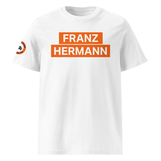 White organic cotton unisex t-shirt with bold orange "FRANZ HERMANN" block text on chest, inspired by Max Verstappen’s Nürburgring GT3 meme, front view. TheTeeShop F1 motorsport fan apparel.
