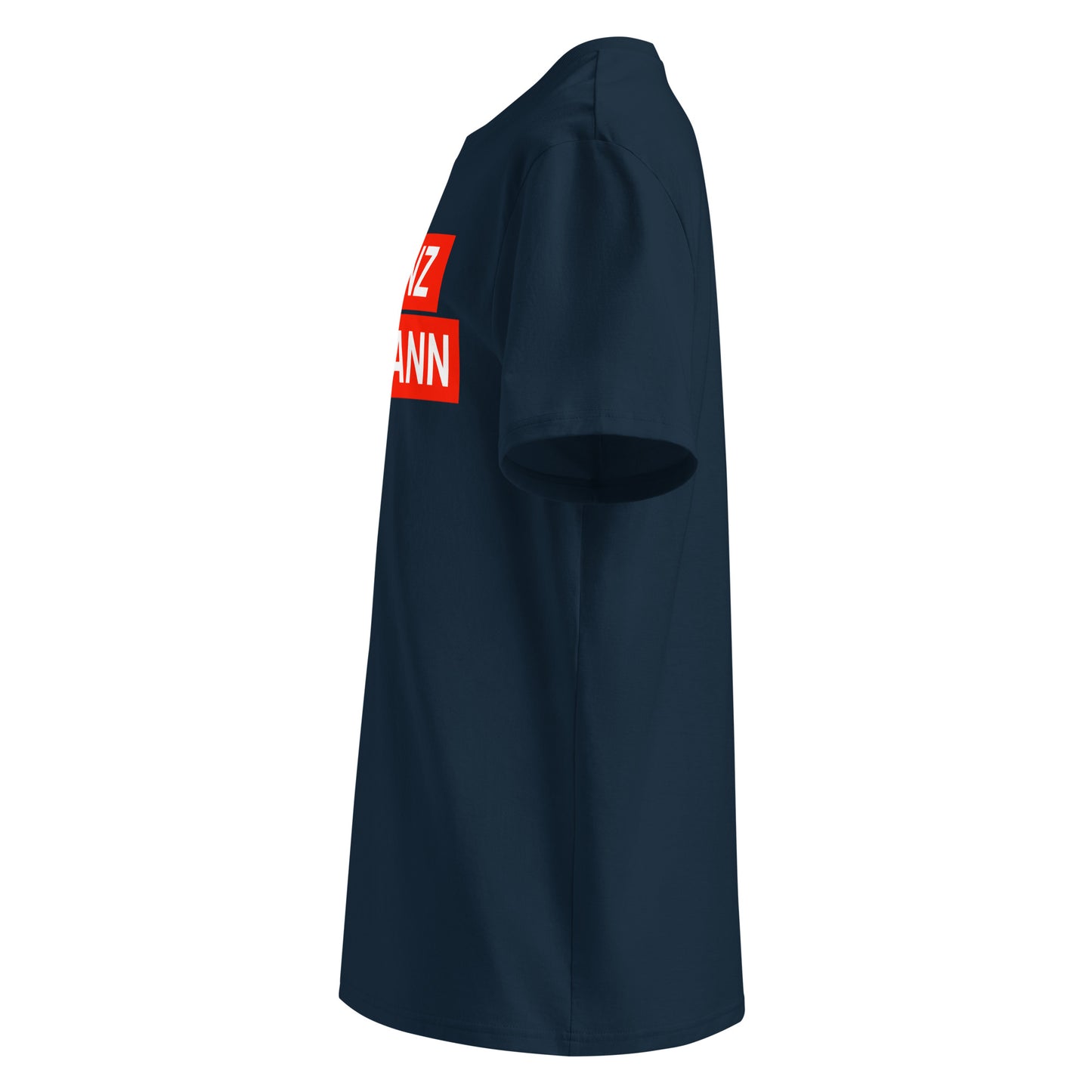 Left side view of navy "FRANZ HERMANN" meme t-shirt, showing red block lettering and round TheTeeShop sleeve logo. Designed for F1 and GT3 racing fans.