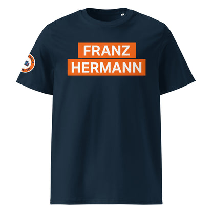 Navy blue organic cotton unisex t-shirt with striking orange "FRANZ HERMANN" block text, Max Verstappen Nürburgring GT3 meme, front view. TheTeeShop motorsport fanwear.