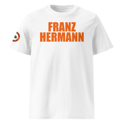 White organic cotton unisex t-shirt with bold orange "FRANZ HERMANN" lettering, right sleeve logo, perfect for Dutch Max Verstappen fans and F1 meme collectors, front view.
