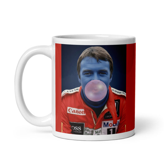 White ceramic 11oz mug with a bold red background featuring a pop-art style portrait of Nigel Mansell in a red racing suit, blue-tinted face, and blowing a bubblegum bubble.