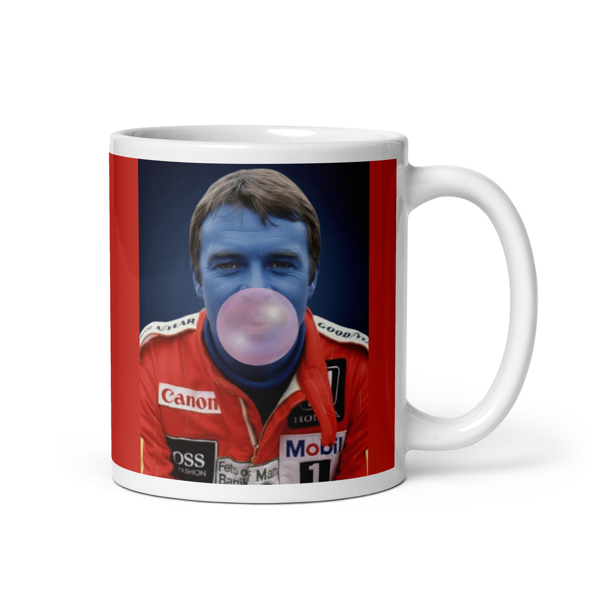 White ceramic 11oz mug with a bold red background featuring a pop-art style portrait of Nigel Mansell in a red racing suit, blue-tinted face, and blowing a bubblegum bubble.