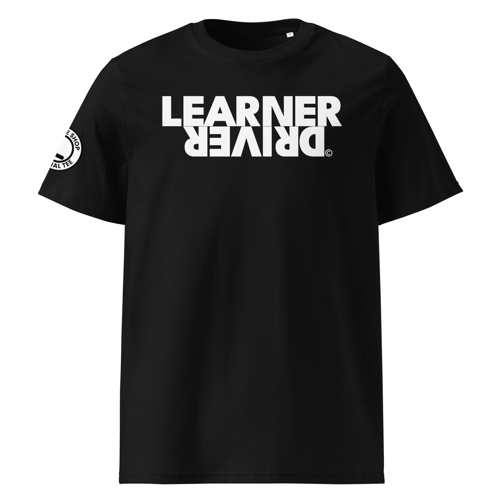 Black organic cotton t-shirt with bold white “LEARNER DRIVER” text printed upside down on the front, right sleeve logo, perfect for car meet fans and new drivers, front view.
