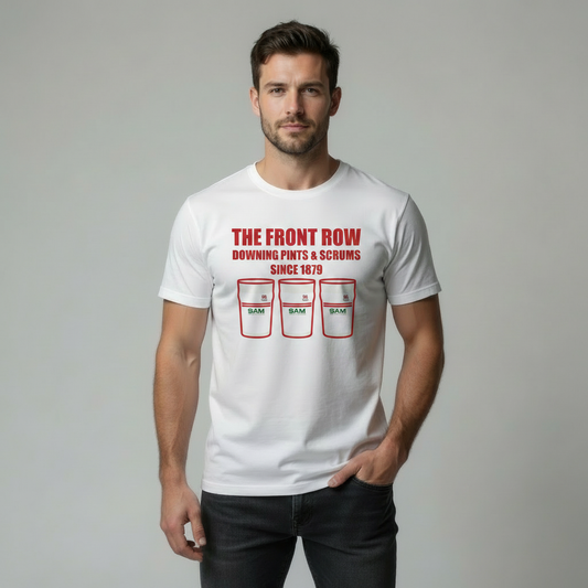 Man wearing a white Ulster rugby t-shirt with red text and graphics on a grey background