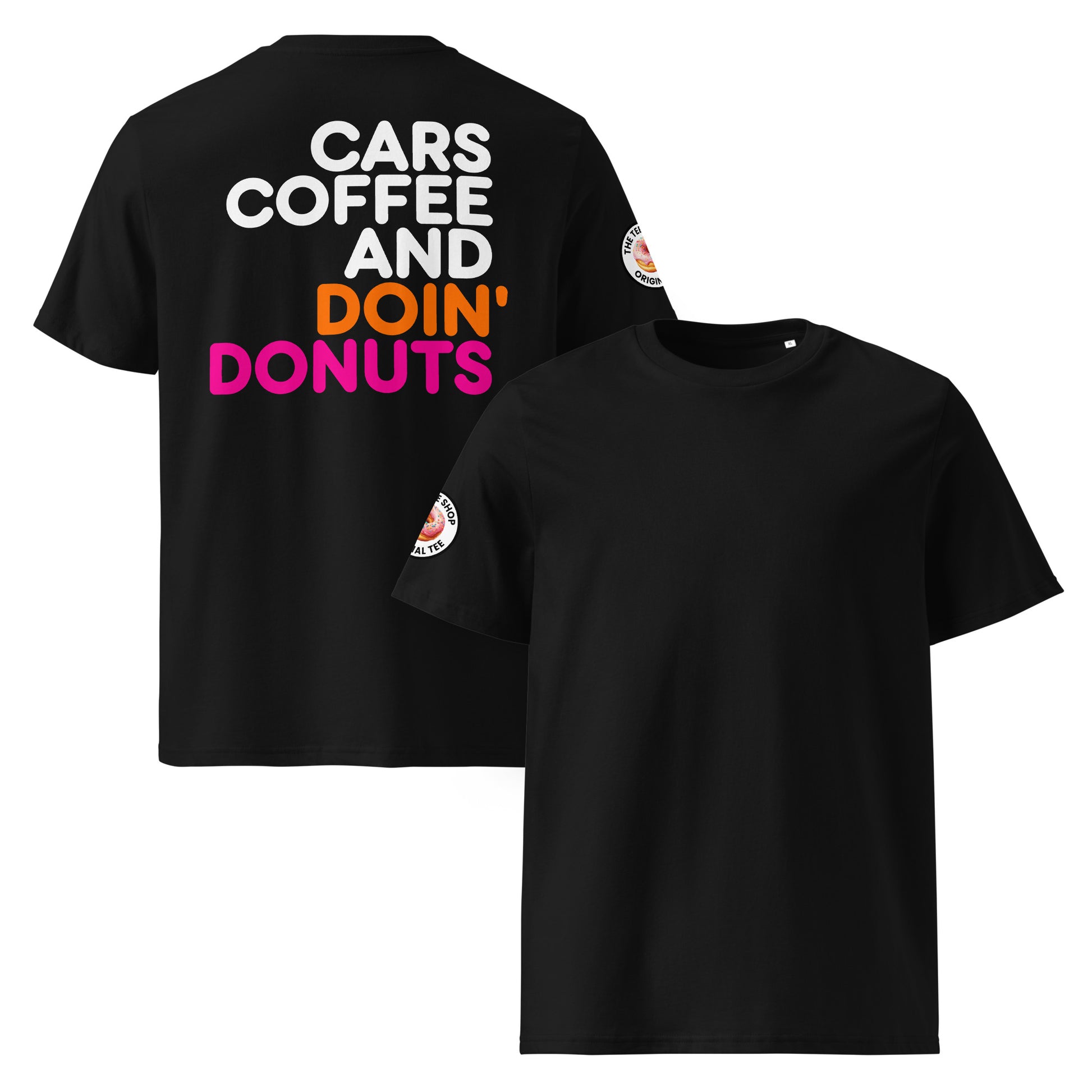 Black unisex t-shirt with a plain front, bold “Cars Coffee and Doin’ Donuts” slogan in white, orange, and pink Impact font printed large on the back, and The Tee Shop circular donut logo patch on the right sleeve. DTF printed, minimalist car meet tee for petrolheads who love a statement back print and clean style.