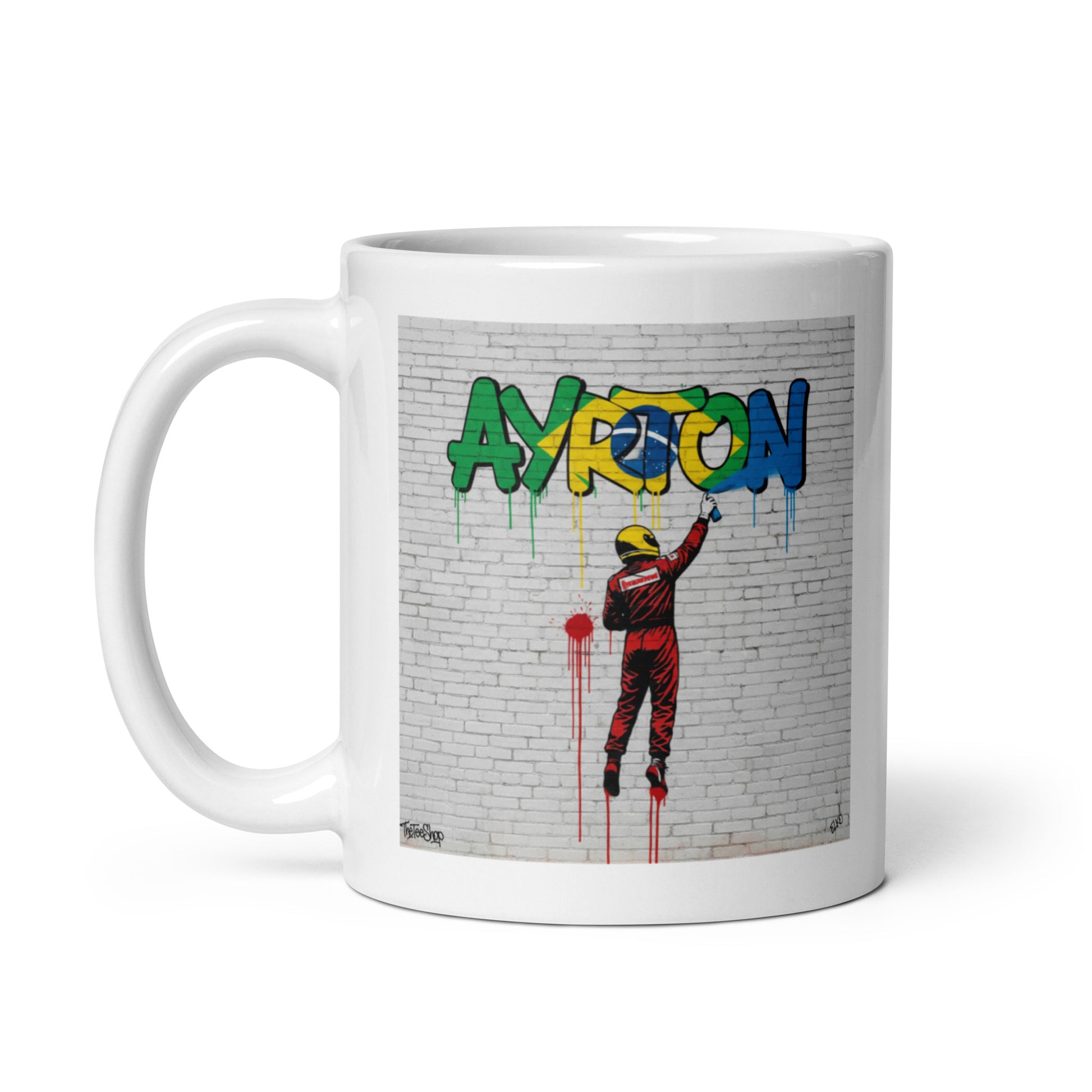11oz white Ayrton Senna graffiti mug with handle on left.