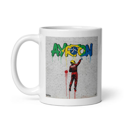 11oz white Ayrton Senna graffiti mug with handle on left.