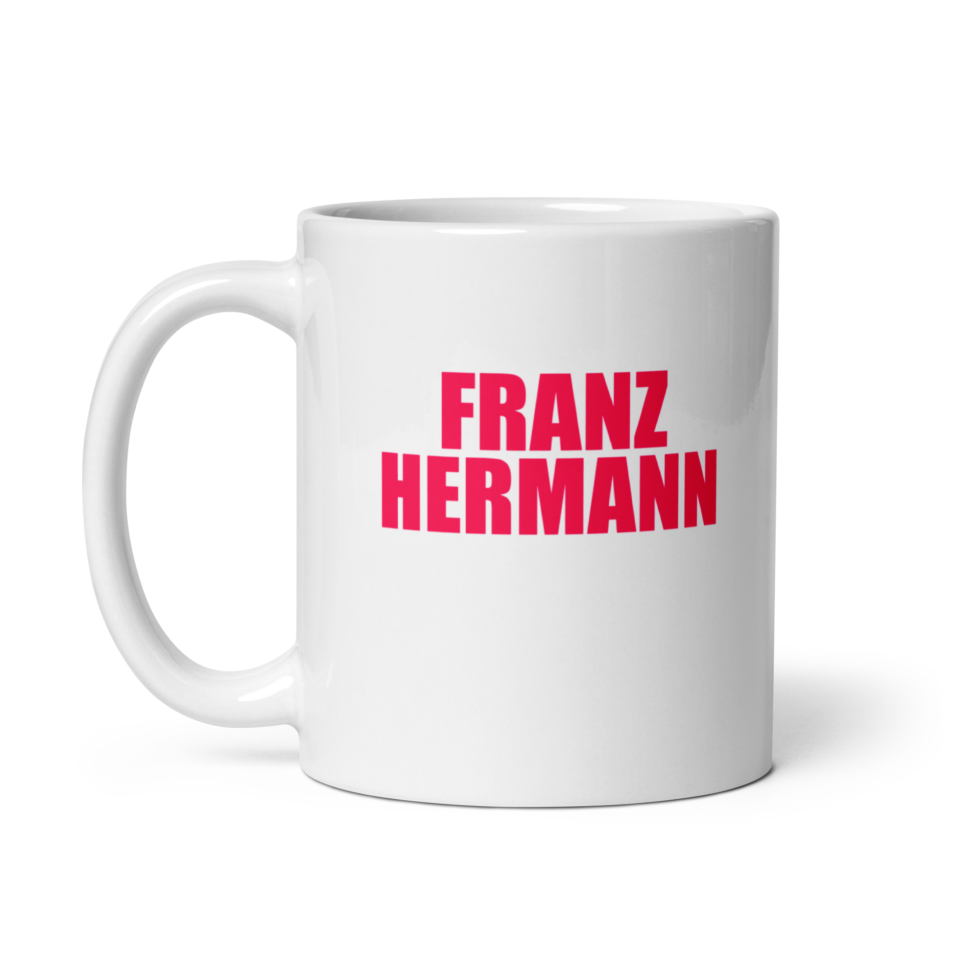 White mug with red bull pink text 'FRANZ HERMANN' on a white background. Handle on left.
