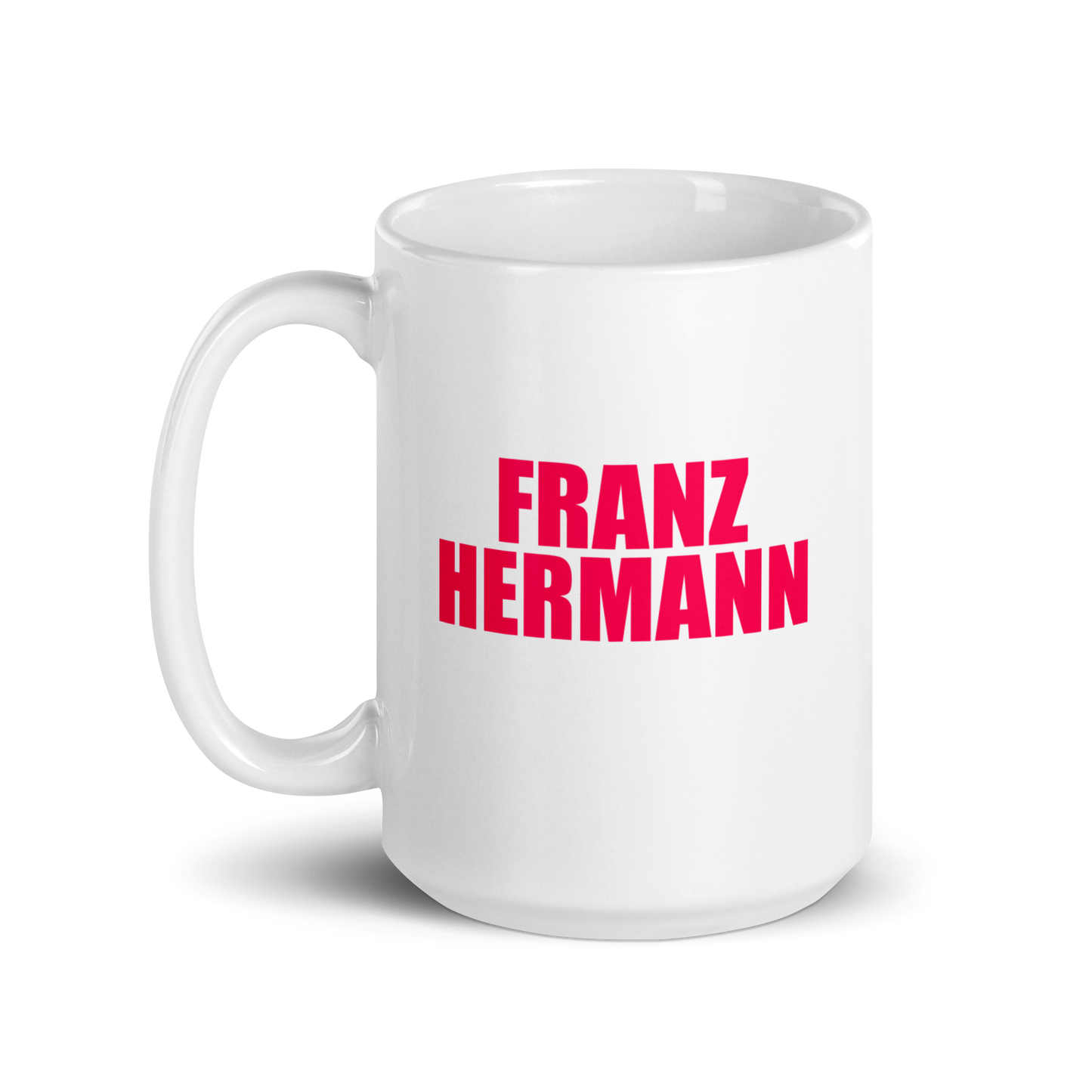 15oz White mug with red bull pink text 'FRANZ HERMANN' on a white background. Handle on left.
