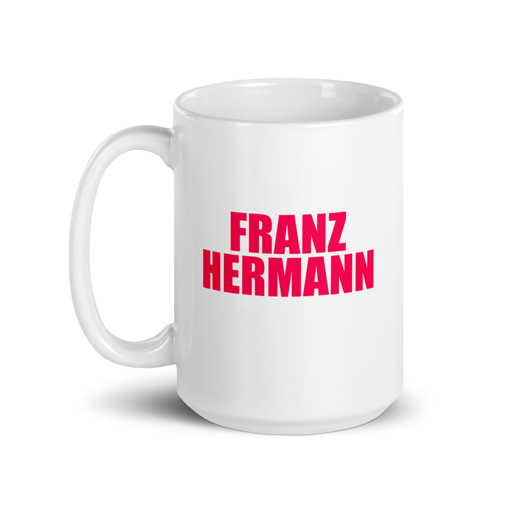 15oz White mug with red bull pink text 'FRANZ HERMANN' on a white background. Handle on left.