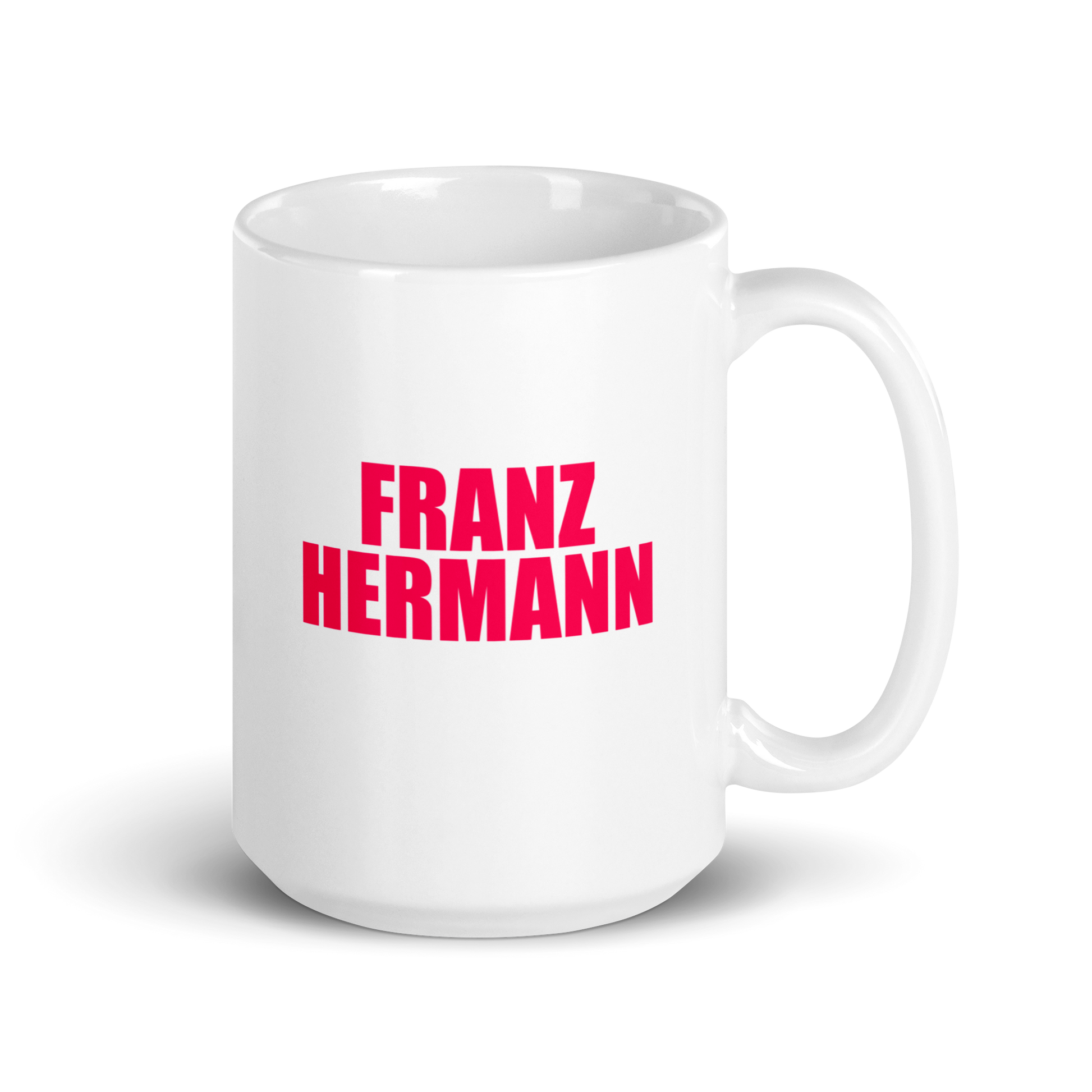 15oz White mug with red bull pink text 'FRANZ HERMANN' on a white background. Handle on right.