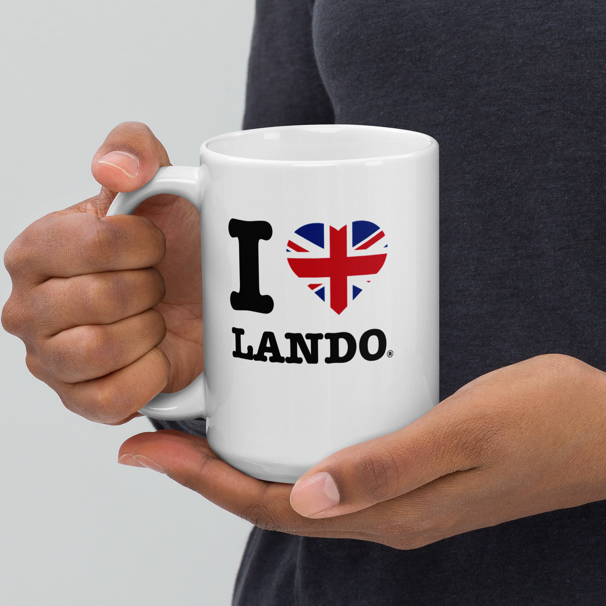 Person holding a white mug with 'I ❤️ Lando' design on a light gray background